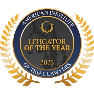 Badge signifying David M. Kennedy was awarded Litigator of the Year by the American Institute of Trial Lawyers