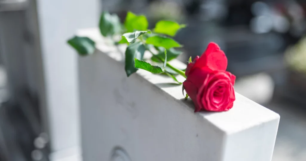 Image of a flower placed on top of a tombstone signifying wrongful death claims