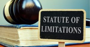 An image of a gavel and a sign reading statute of limitations