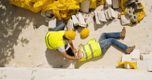 An image featuring workplace accidents, a fallen construction worker