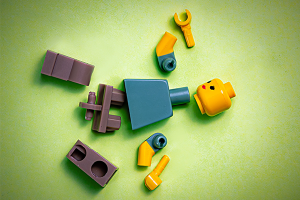 Image of a broken toy as a metaphor for a personal injury that will require an insurance claim.