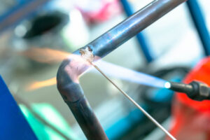 Welding image featuring the Lockout tagout (LOTO) safety procedure that shuts down and secures equipment to prevent explosions