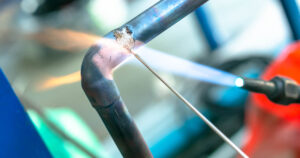 Welding image featuring the Lockout tagout (LOTO) safety procedure that shuts down and secures equipment to prevent explosions